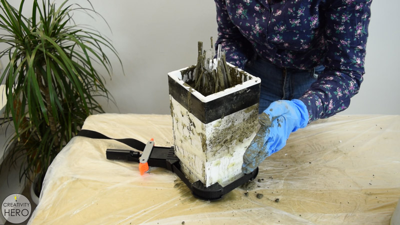 DIY Acrylic and Concrete Lamp with a Wooden Base 11 - Pouring the Concrete into the Mold and Vibrating by Hand to Release the Air Bubbles